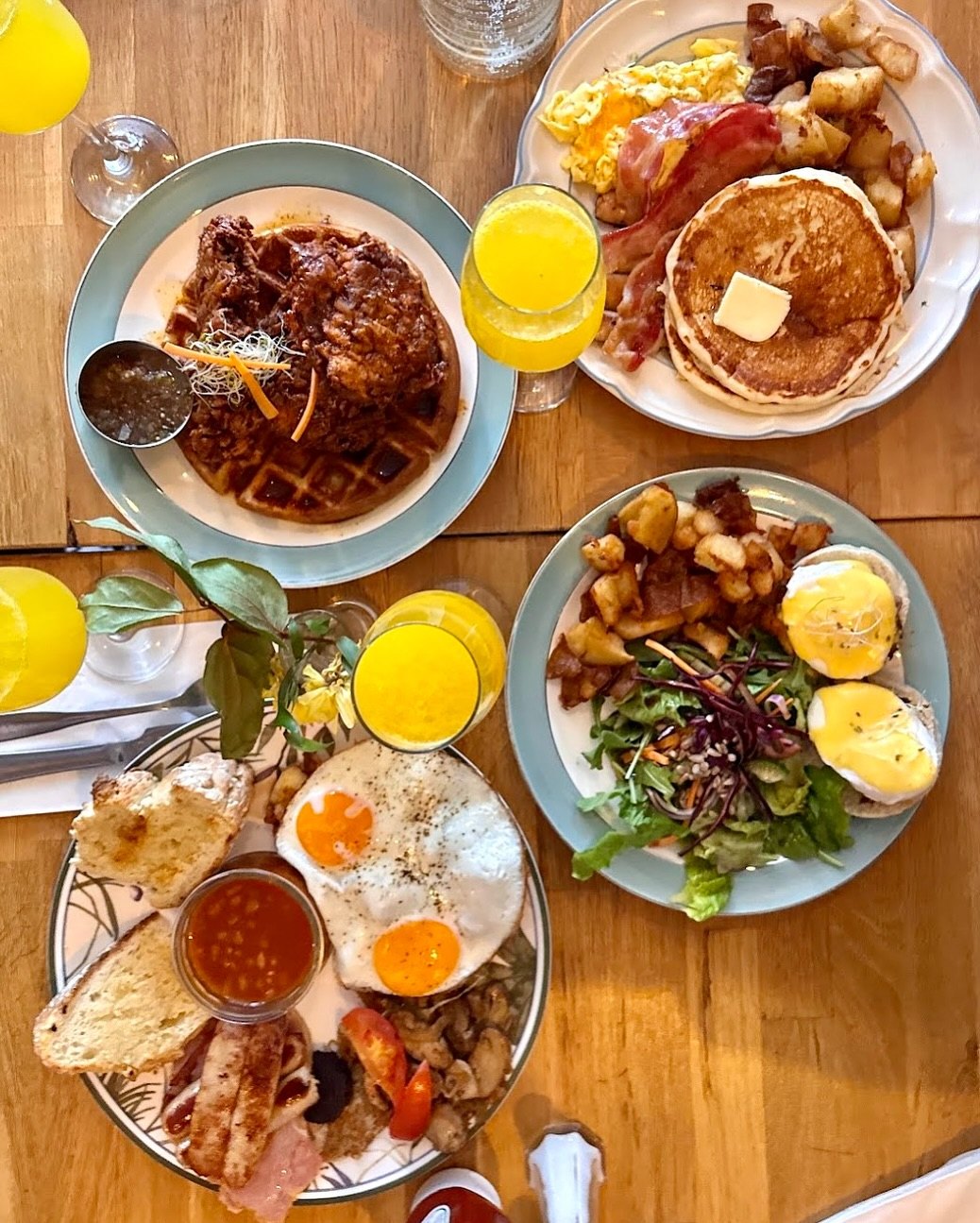 A full brunch table at Nina's Brunch Restaurant in Kensington Market