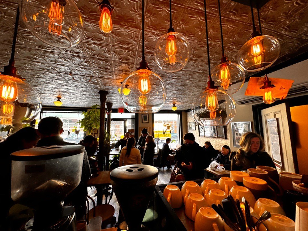 Warm interior and bar seating at Ost Cafe